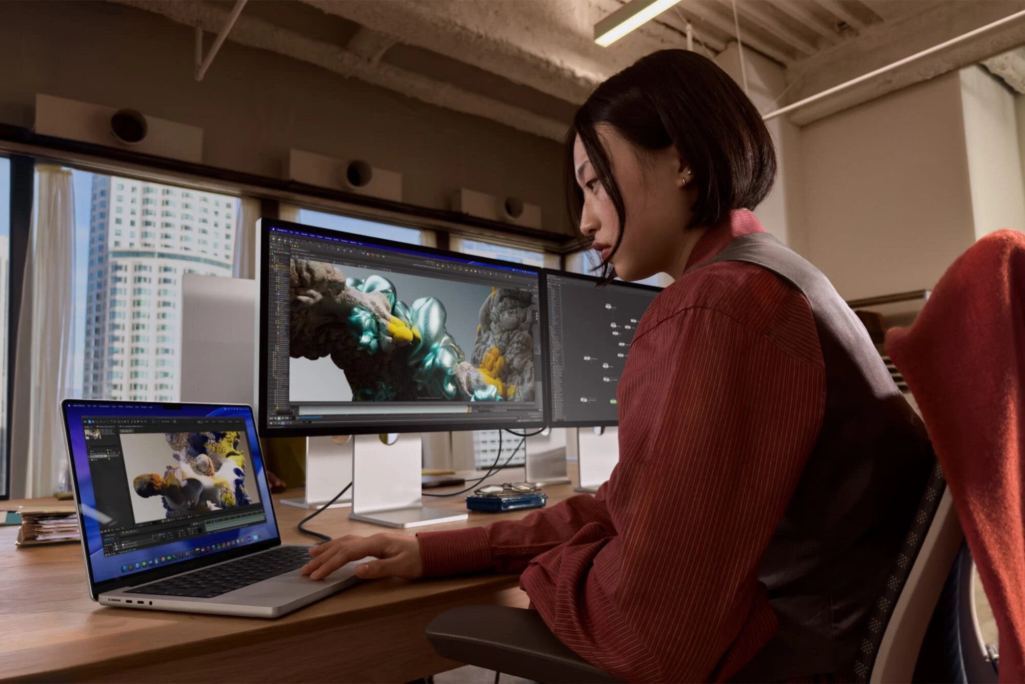 a woman working on a new macbook pro
